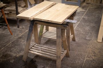 Workbench for sawing board. Carpenter's workplace. Details of carpentry workshop.