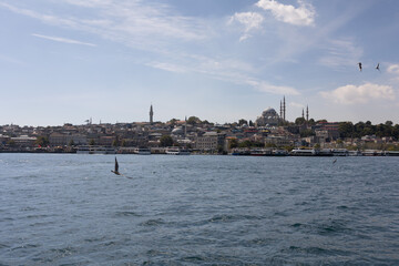 Fototapeta premium silhouette Istanbul city buildings from water Bosphorus or Golden Horn, public places.