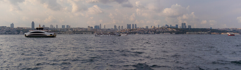 Naklejka premium silhouette Istanbul city buildings from water Bosphorus or Golden Horn, public places.
