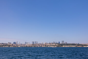 Fototapeta premium silhouette Istanbul city buildings from water Bosphorus or Golden Horn, public places.