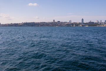Fototapeta premium silhouette Istanbul city buildings from water Bosphorus or Golden Horn, public places.