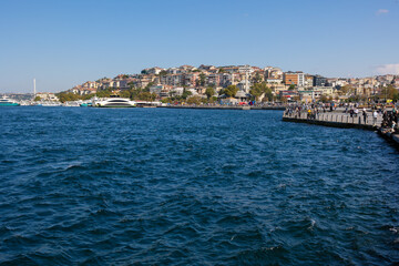 Fototapeta premium silhouette Istanbul city buildings from water Bosphorus or Golden Horn, public places.
