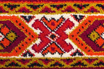 Fototapeta na wymiar Part of old vintage carpet texture with abstract ornament