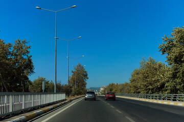 Highway wide road, transport and blue sky with clouds on a summer day