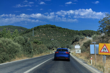 Fototapeta premium Highway wide road, transport and blue sky with clouds on a summer day