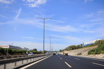 Highway wide road, transport and blue sky with clouds on a summer day