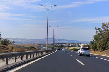 Highway wide road, transport and blue sky with clouds on a summer day