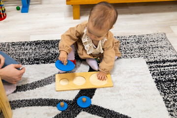 Toddler solving three circle puzzle