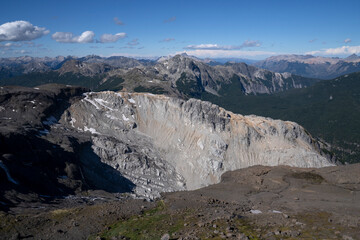 Alpine landscape. Panorama view of the mountains and peaks in a sunny summer day.