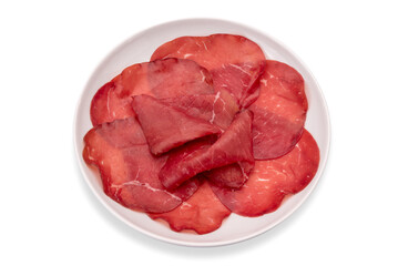 Bresaola slices in white plate isolated on white clipping path, italian dried beef salami from Valtellina