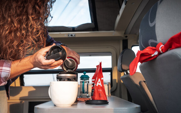 Woman Making Coffee in Van