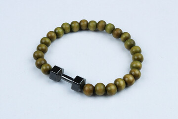 Green bead bracelet with dumbbell symbol