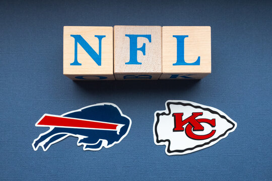 January 20, 2022. Kansas City, Missouri. The Emblems Of The Football Clubs Participating In The Playoffs Of The National Football League Buffalo Bills And Kansas City Chiefs On A Blue Background.