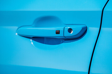 Door handle of a modern blue car