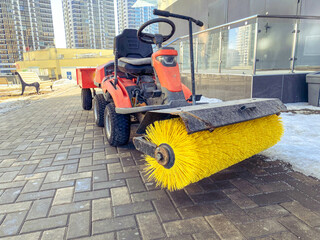 construction of houses. cleaning the workplace with a special car with a huge, brush for cleaning...