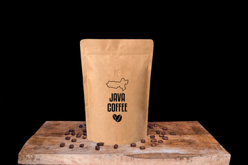 Java coffee beans and eco friendly kraft paper package on wooden board with black isolated background