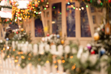 christmas background fair blurred with shopping stalls with decorations with magic lights