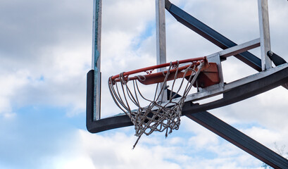 Broken glass backboard and broken hoop on the basketball court © fifg