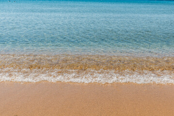 Fototapeta na wymiar Agios Petros beach in Andros on a beautiful summer day, Cyclades, Greece