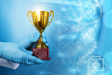 best doctor, medical award, golden cup in doctor's hands on background of planet with international connections, Element of the image provided by NASA