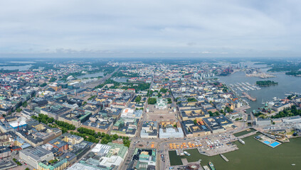 Helsinki Downtown Cityscape, Finland. Cathedral Square, Market Square, Sky Wheel, Port, Harbor in Background. Drone Point of View