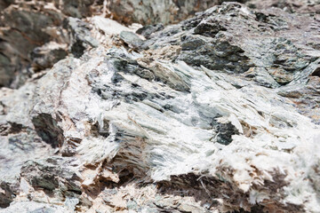 Fototapeta na wymiar Asbestos vein sinuosity in its natural geological environment and asbestos fibers, chrysotile and tremolite, French Alps