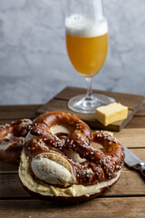 German Pretzel called Brezel,pastry from Southern with butter and glass of beer Germany,very popular in Oktoberfest.