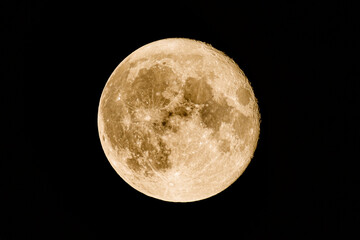 Big yellow super moon (blood moon) as seen from Normandy, France, in July 2022