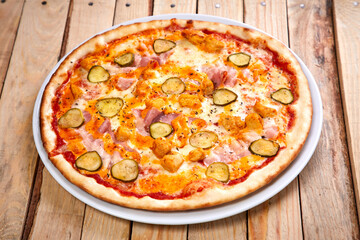 tasty pizza on the wooden background