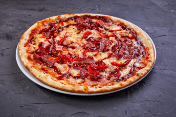 tasty pizza on the wooden background