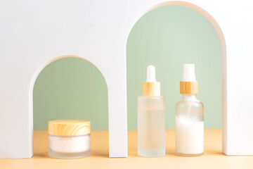 Various blank cosmetic container mock-ups on podiums and geometrical forms. Background for branding and packaging presentation. Natural skincare beauty product concept