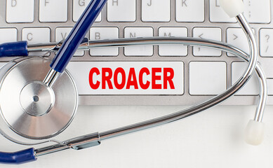 CROAKER text on keyboard with stethoscope , medical concept