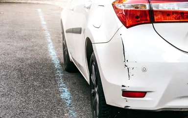 Deurstickers Scraped Rear Bumper of a Parked Car as a Result of Poor Judgment or Inattention, Cosmetic Defect Requiring Repair and Insurance Claim © czitrox