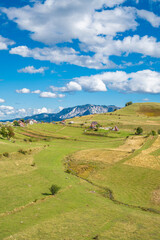 An old mountain village with roofs made of cut old barrels with a beautiful view of the landscape - great for wallpaper