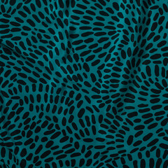 Close-up detail of green geometric fabric from a vintage skirt. 1990s fashion style.