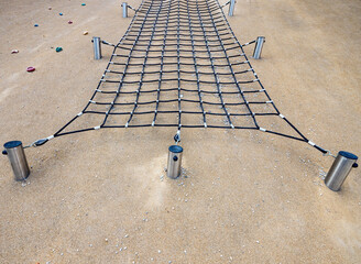 Climbing net wall in outdoor kids playground gym