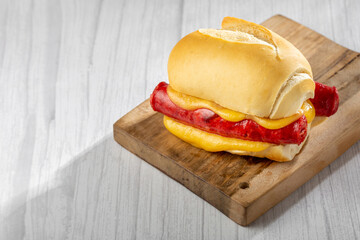 Sausage sandwich with melted cheese.