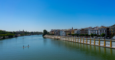 Views from the Triana Bridge in Seville, Spain. Guadalquivir river. 