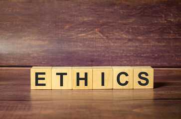 ethics symbol. Concept words ethics on wooden blocks