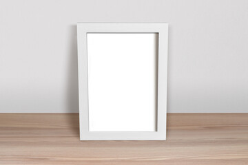 White Frame Mockup Leaning in Minimalist Room Scene