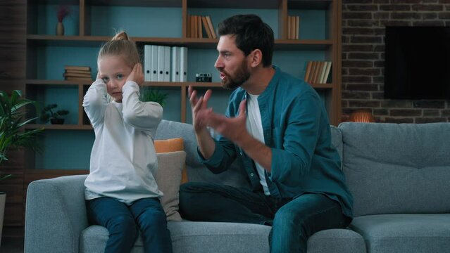 Irritated annoyed father scold daughter for bad behavior dad shout at rebellious kid scream loud voice small naughty girl ignoring angry man conflict generations in family parents and children quarrel
