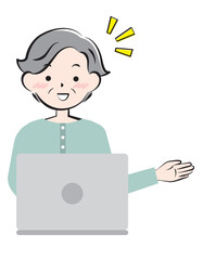 パソコン操作で案内するシニア女性