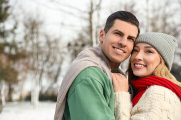 Fototapeta premium Beautiful happy couple outdoors on winter day