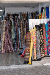 Colorful fabric being sold in a stall in a Tel Aviv Market