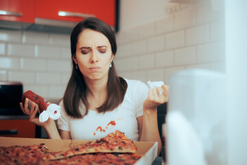 Unhappy Woman Staining her White Blouse with Ketchup Sauce. Tired girl having a messy accident while eating pizza
