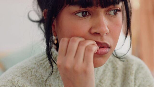 Stress, anxiety and fear of a woman in her bedroom or home. Angry, confused or scared gen z person biting nails nervous about mistake, fail or waiting for feedback on results with bad mental health