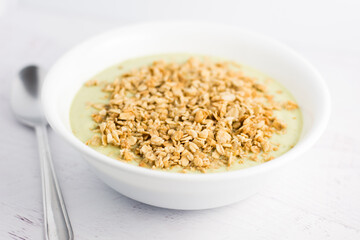 bowl of avocado cream with granola