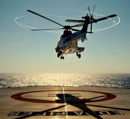 Offshore crew change helicopter takes off from helideck at early evening-Bass Strait.