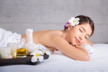 Asian woman sleep and relax in Thai spa shop