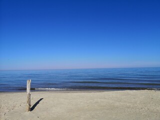 Empty Baltic sea beach and calm sea - 532875981